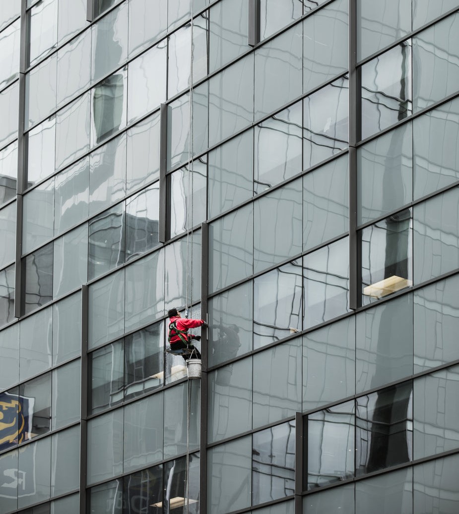 a-window-washer-dangles-from-a-skyscraper